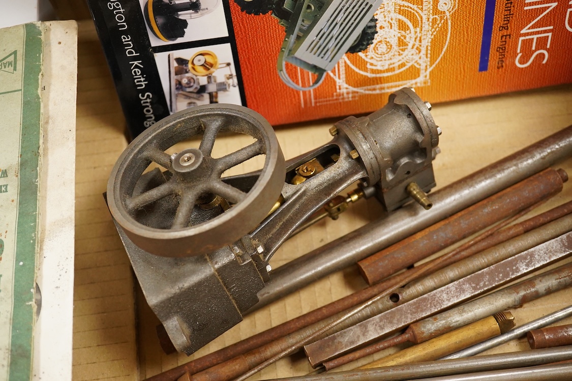 A Stuart No.10 vertical live steam single cylinder stationary engine, together with the original instruction booklets, a book on Sterling engines, and a quantity of useful ferrous and non-ferrous rods